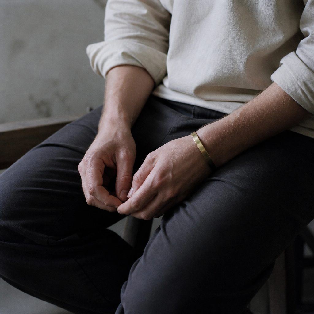 Hands resting in a lap while seated